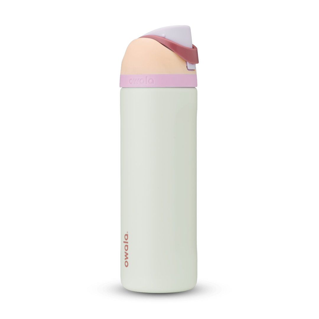 FreeSip 24oz in Coastal Mist, pale mint green body with peach flip cap, dusty rose carry loop, and pink accent band
